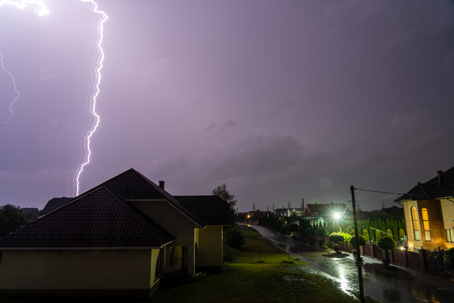 lightning bolt above a residential home